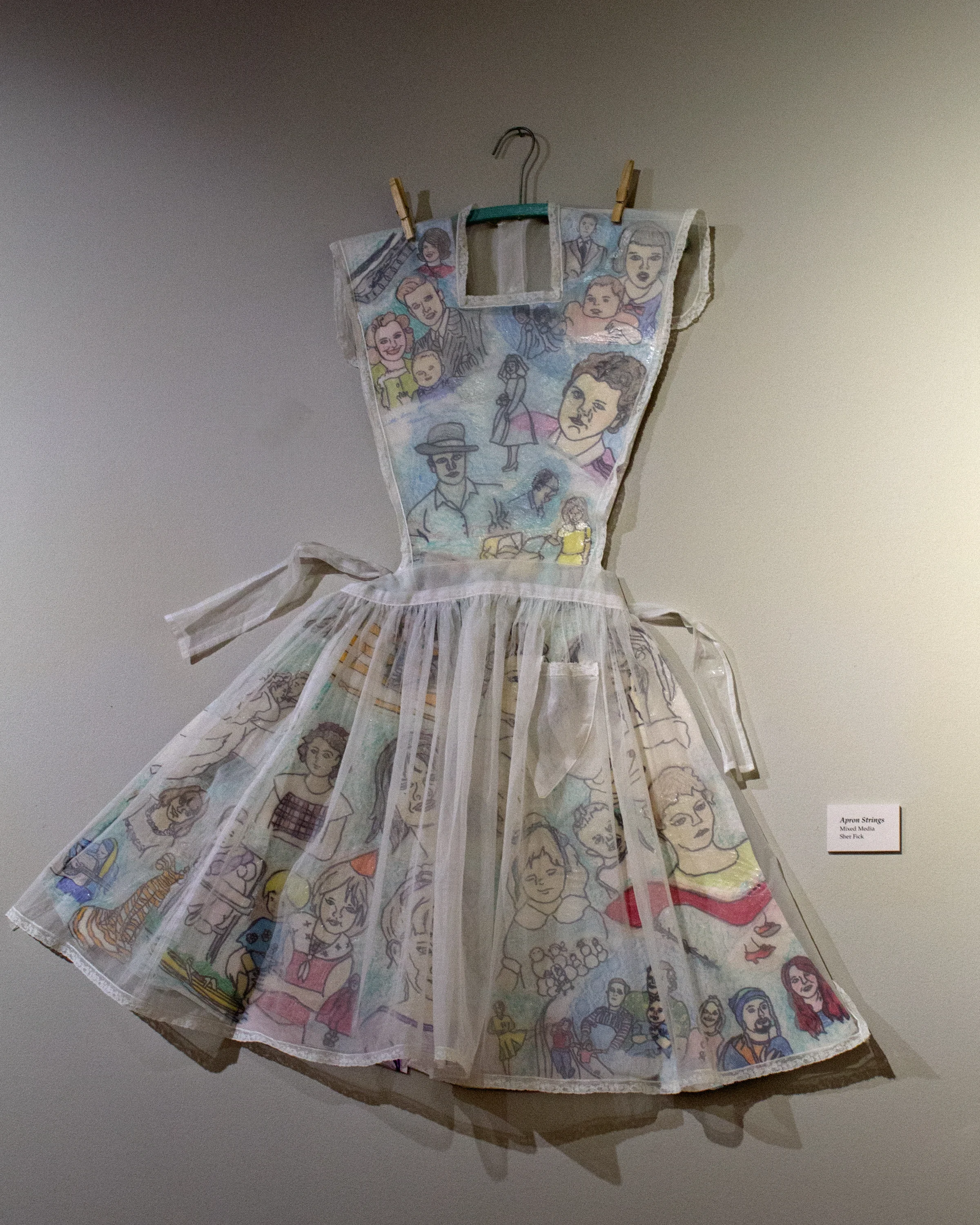 "Apron Strings", view of familial drawings of artist