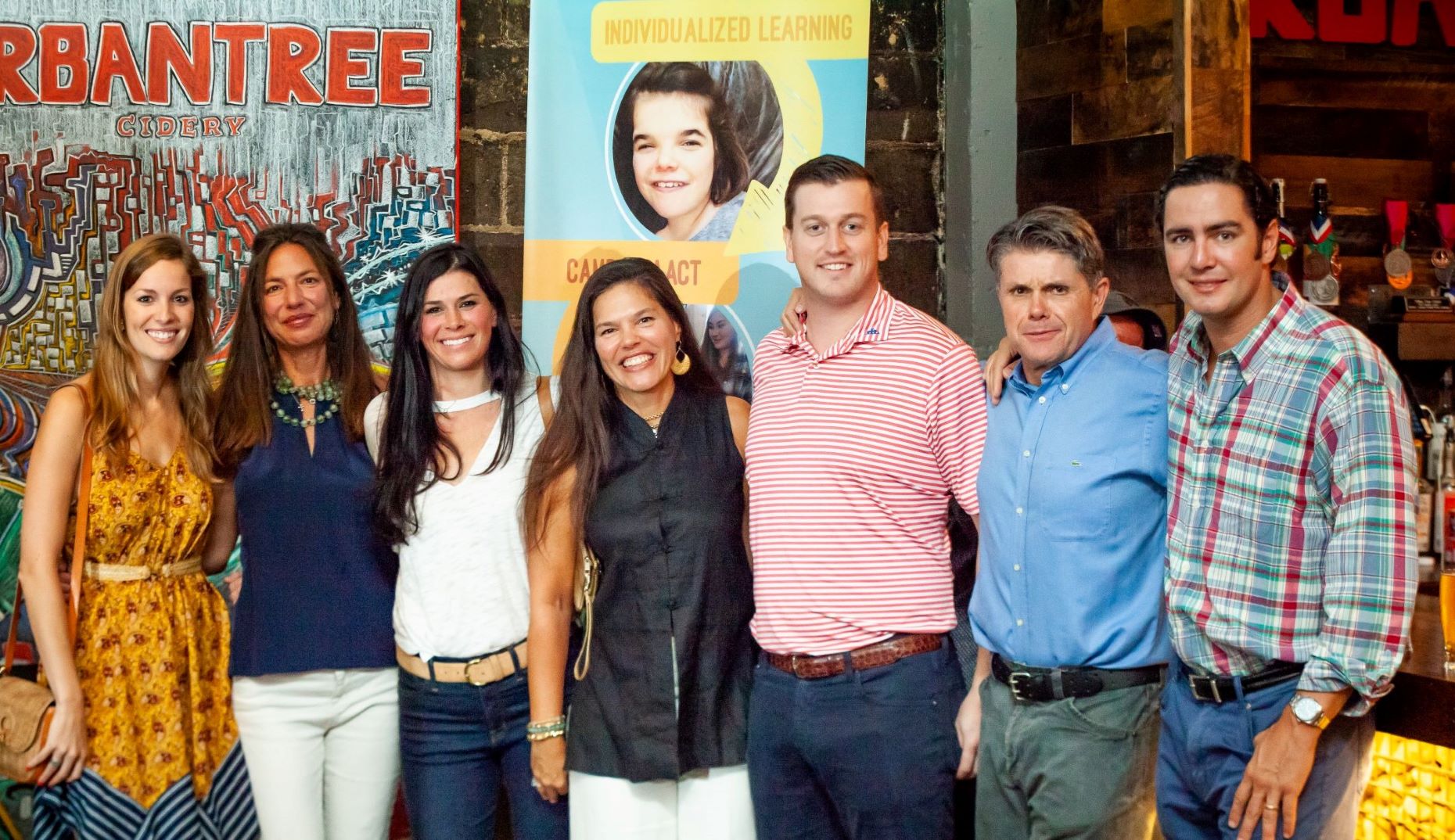 Rhonda and Friends in Front of Banner pt.2.jpg