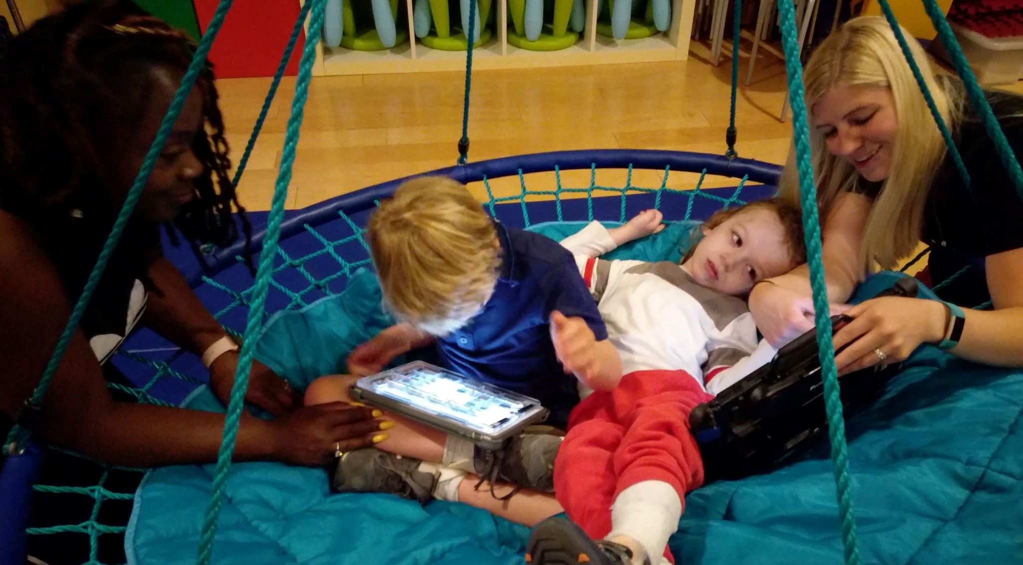 Jack and Taylor in Swing Using Devices.jpg