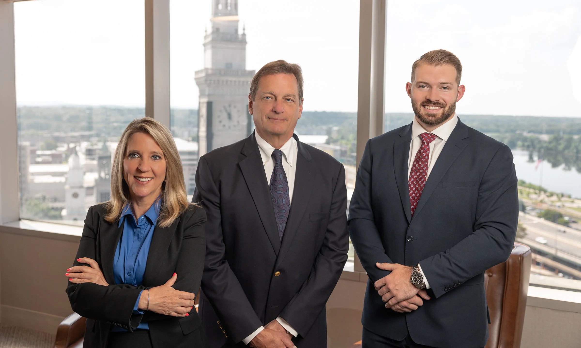 corporate style portrait of three people.