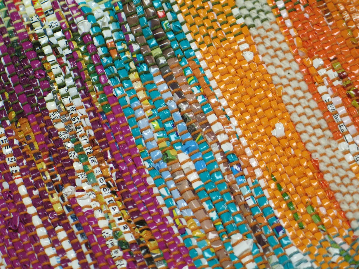 Shopping bag made with recycled plastic bags by Vivian Downing. Used on Advertise in the Newsletter information page.