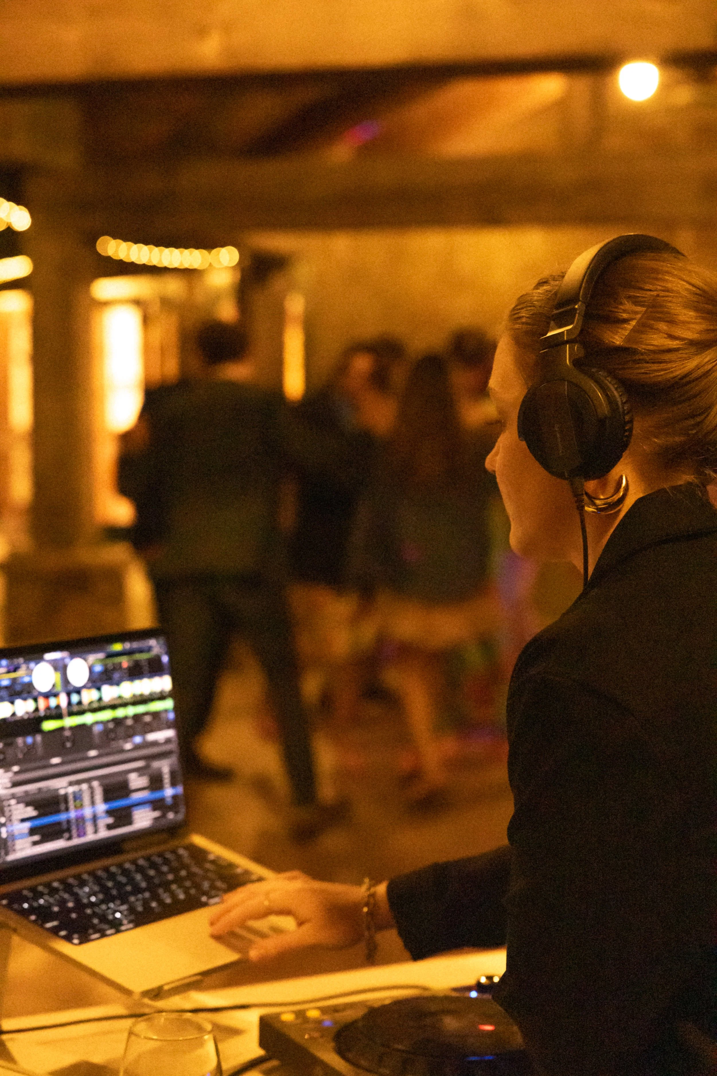Tara Rook DJing a wedding, soft lighting
