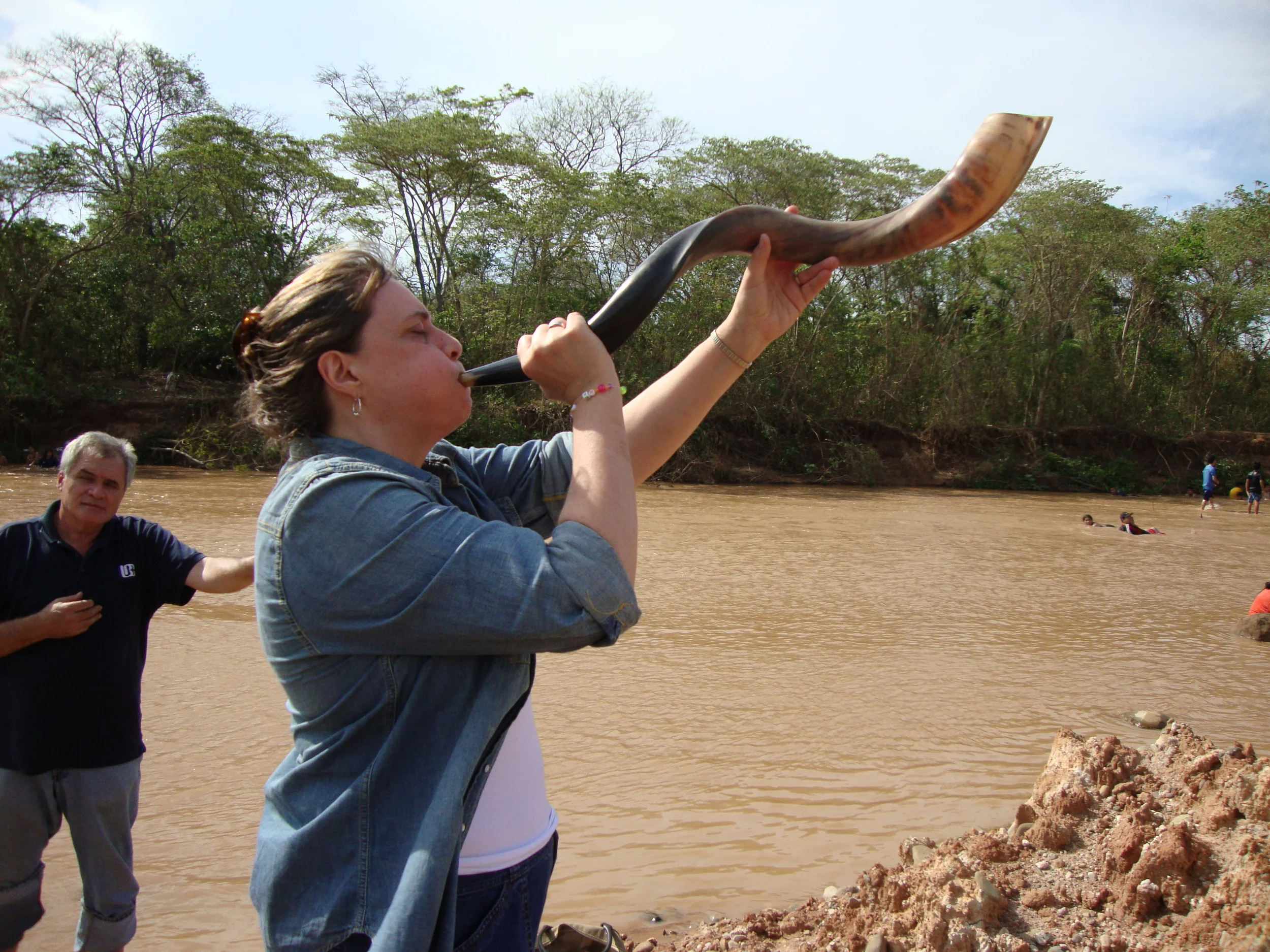 Ann blowing shofar at River Pirai