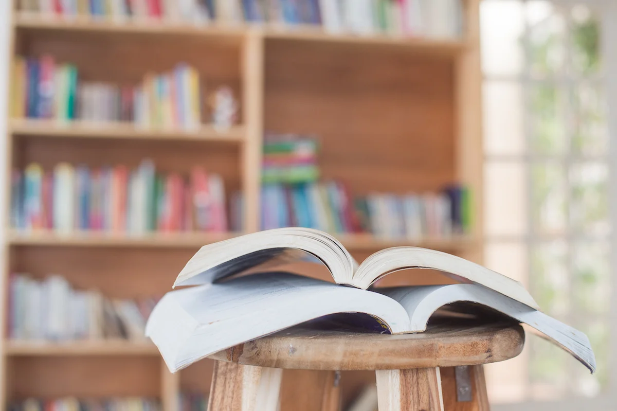 Copy of Copy of Copy of book on chair in the library