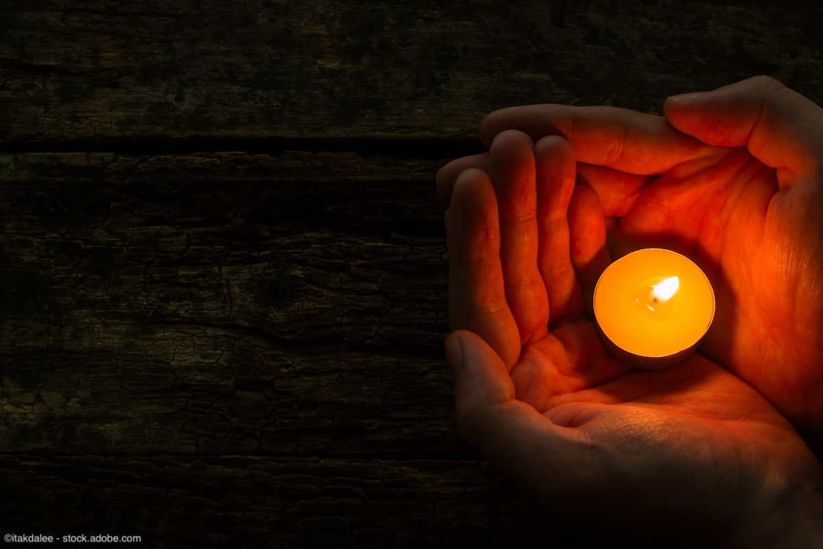 man holding spa candle