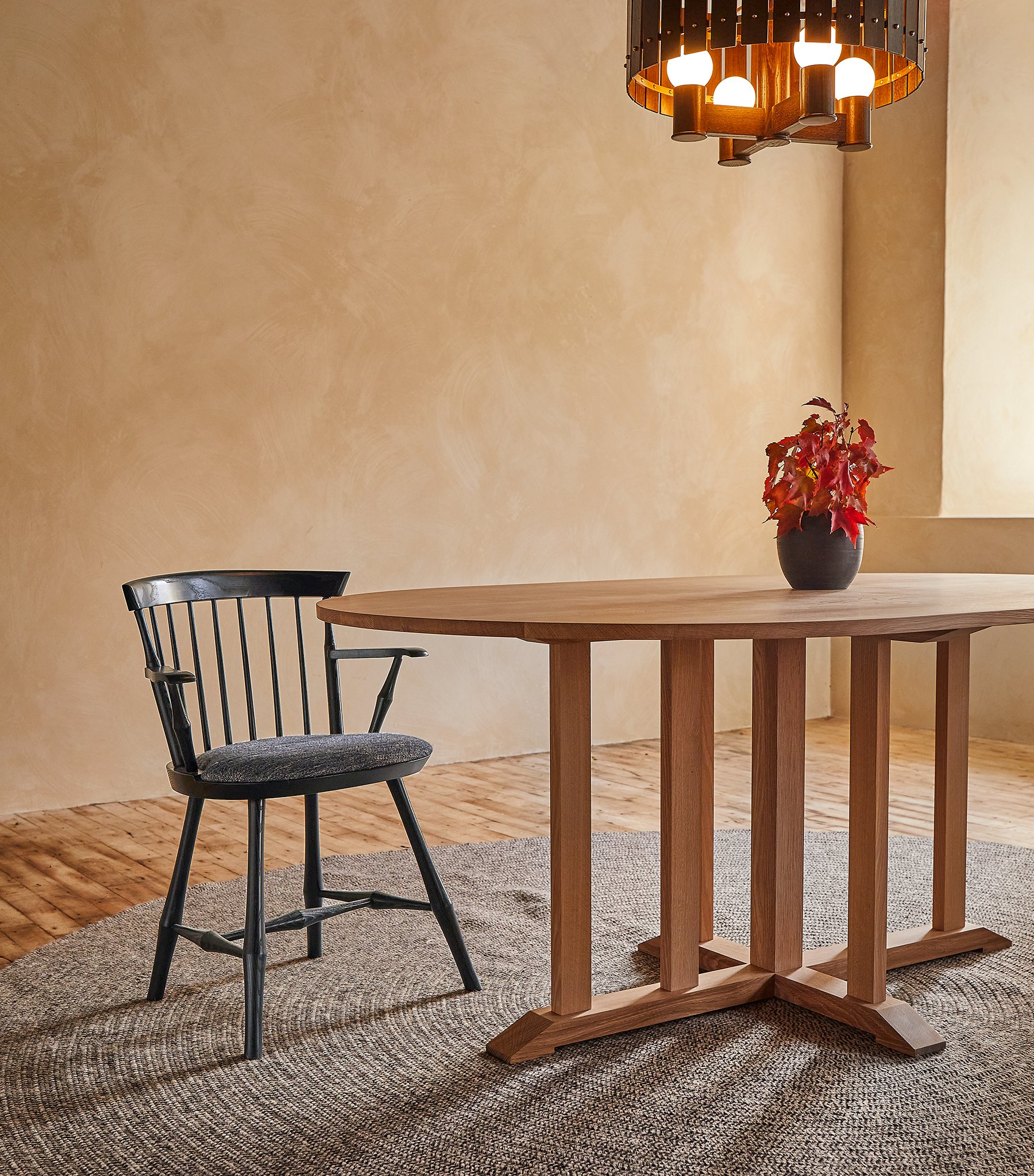 DUSK CHANDELIER-COMPASS TABLE- UPHOLSTERED WAYLAND LOW BACK ARM UPHOLSTERED VIGNETTE.jpg