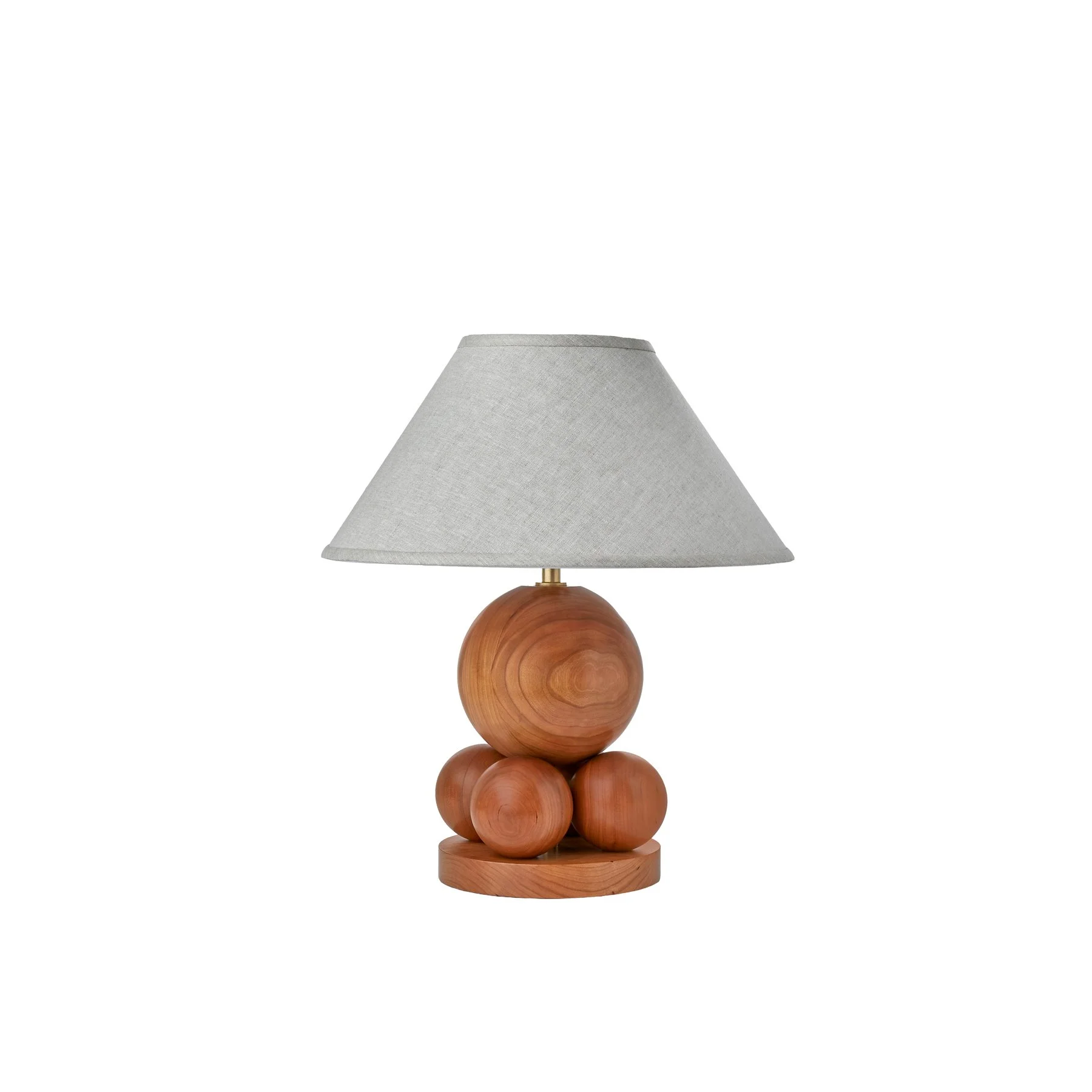 The Mora Lamp is a made-to-order solid hardwood table lamp from O&G Studio, available in ash stain finishes, natural cherry, and natural walnut with a linen shade.
