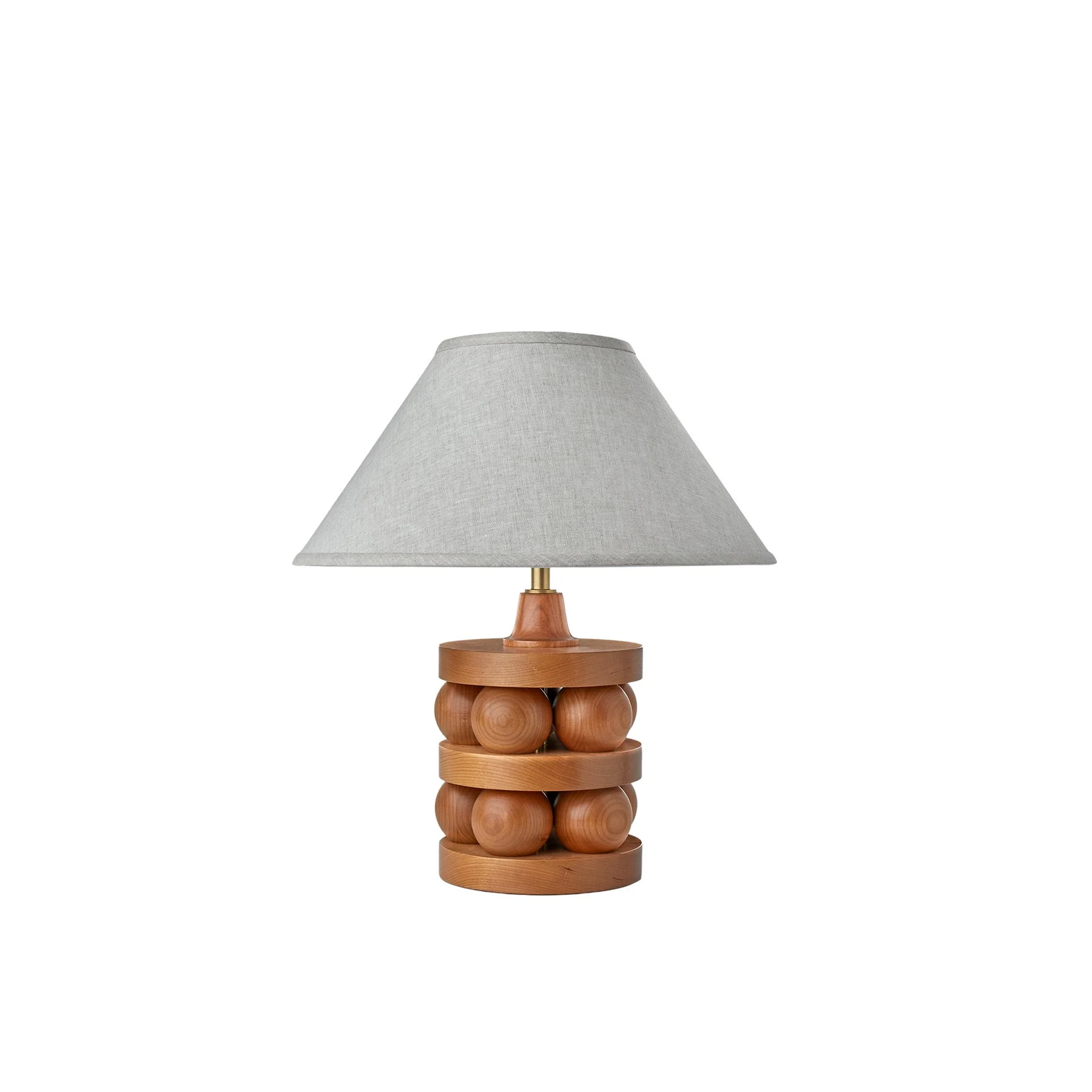 The Lyra Lamp is a made-to-order solid hardwood table lamp from O&G Studio, available in ash stain finishes, natural cherry, and natural walnut with a linen shade.