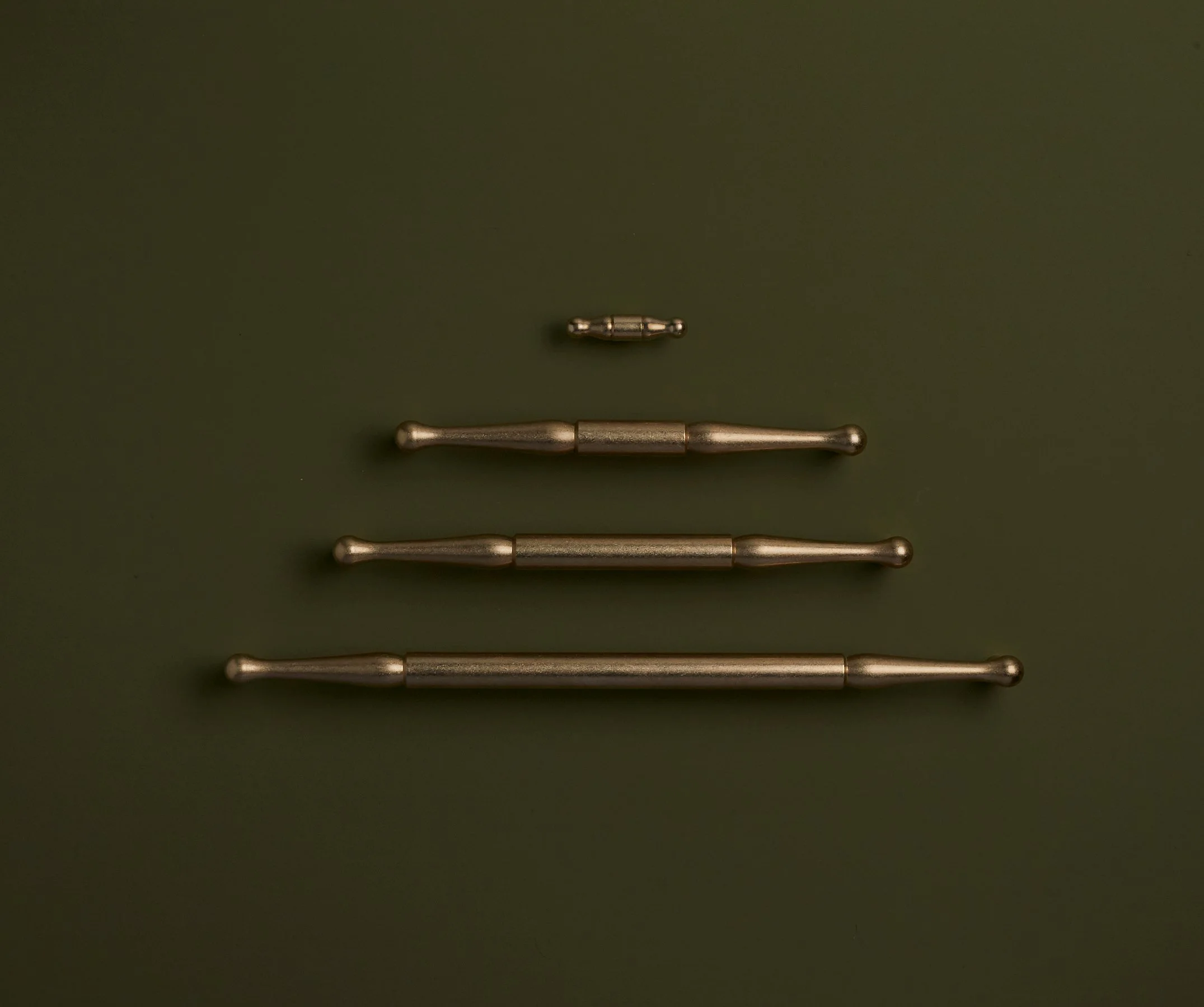 CYGNET-TUMBLED BRASS GROUP-GREEN.jpg