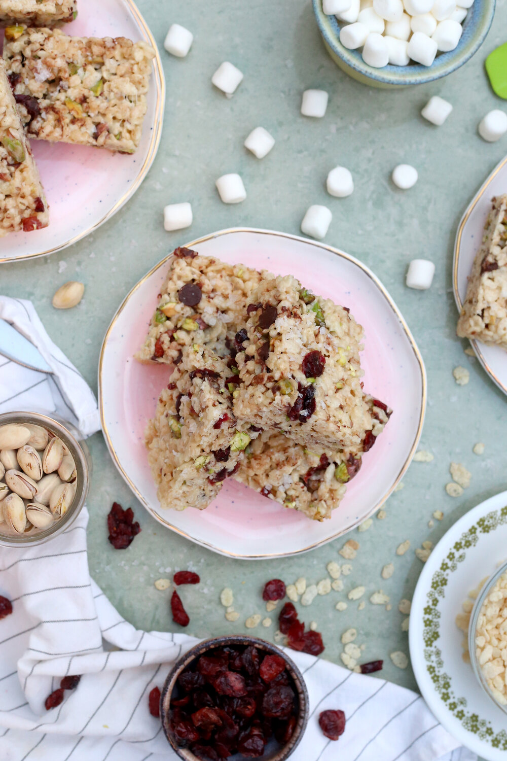 Rice Krispie Treats loaded with Dried Cranberries, Pistachios, & Dark Chocolate. Recipe: Unusuallylovely.com