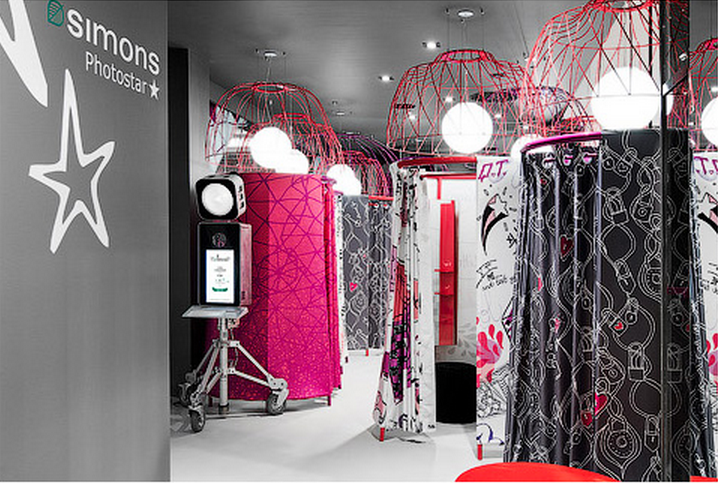 Pod-like fitting rooms that descend from the ceiling complete with Photostar booth. Photo credit: Steve Tsai Photography