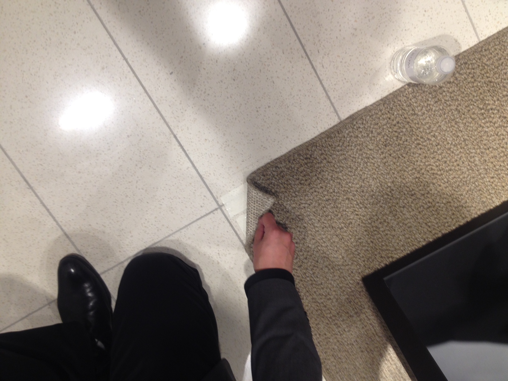 Carpet can be moved to modify the size and shape of departments. Here, we see carpet held by adhesive. 