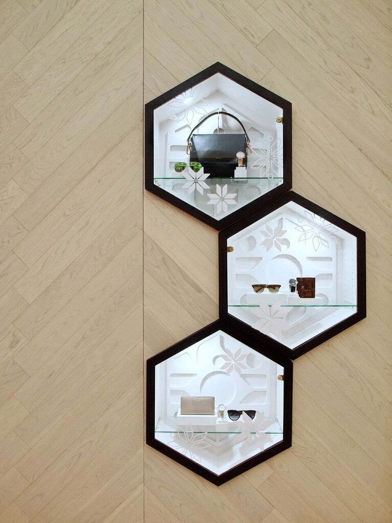 Oversized Hexagon niches draw attention to the store's facade, also providing window displays to showcase product. Photo: Peregrine.Build