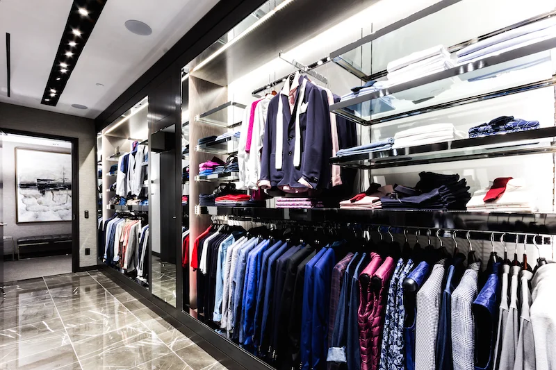 Looking towards the store's dressing rooms, with men's fashions by Corneliani, Zegna and the 'philip' private label.&nbsp;