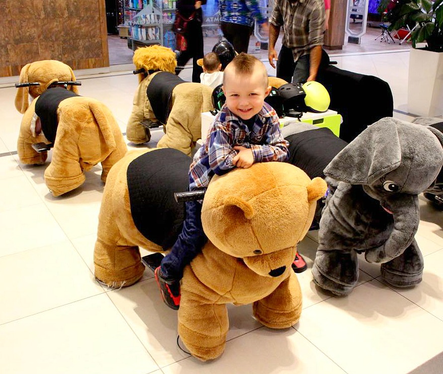 riding stuffed animals in mall