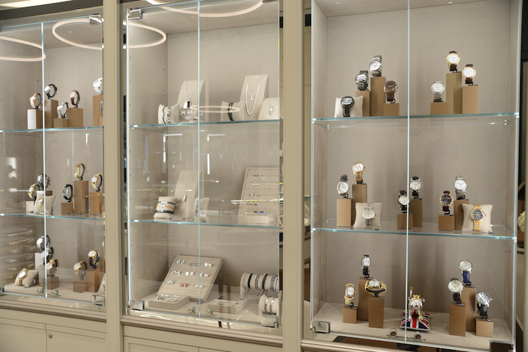 Display cases with men's and women's watches as well as cufflinks and other jewellery pieces. Photo: Tom Sandler