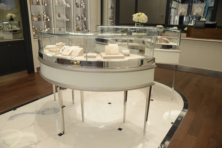 Light marble floor with with black marble lining, contrasting with the store's rich hardwood flooring. Photo: Tom Sandler