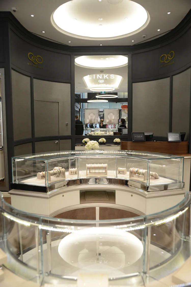 Looking towards the back of the store, which features curved walls and a walnut wood cash desk. Photo: Tom Sandler