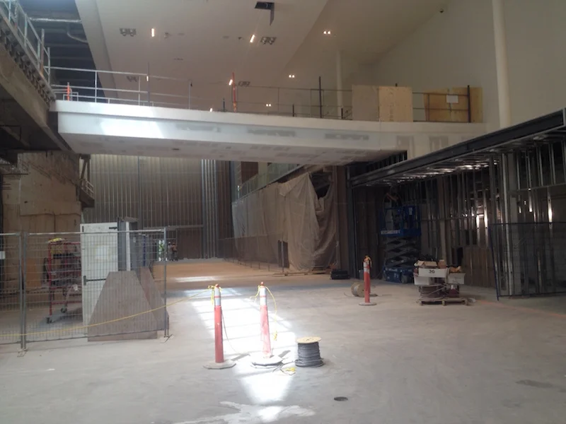 Bridge to Cinneplex theatres. Concierge will be on the right, with Sport Chek's new facade towards the back, behind white tarp.&nbsp;