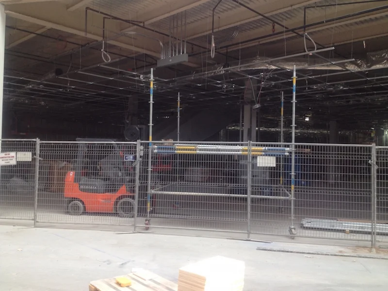 Looking inside the new two-level Uniqlo. An escalator is visible.&nbsp;