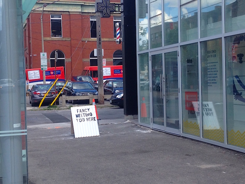 Sandwich board in front of the new store. 