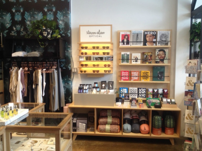 Wallpaper by Toronto artists Rose and Joy Broadbent to the left, also available for purchase in the store. 
