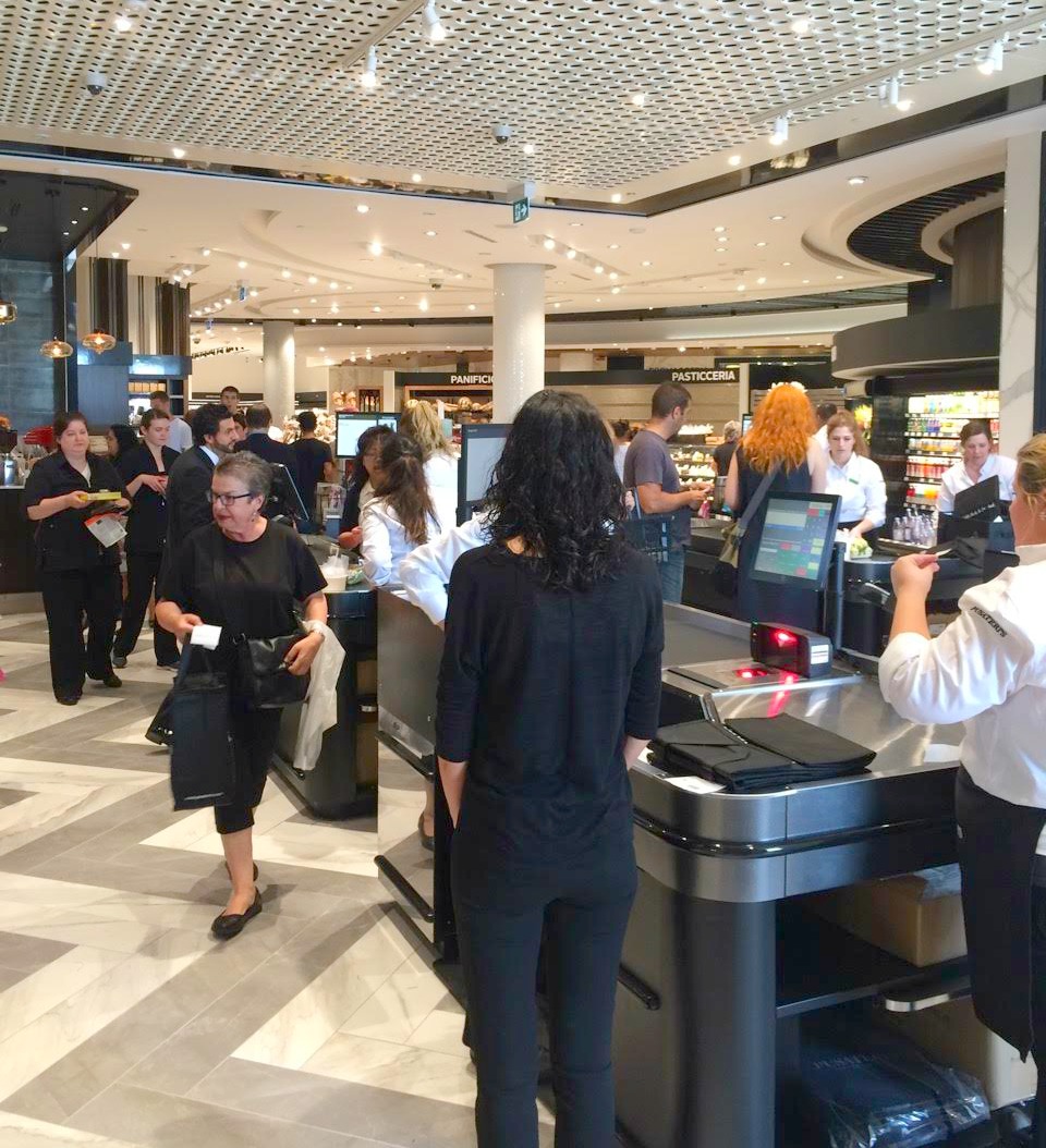 Cash desk, busy with shoppers.