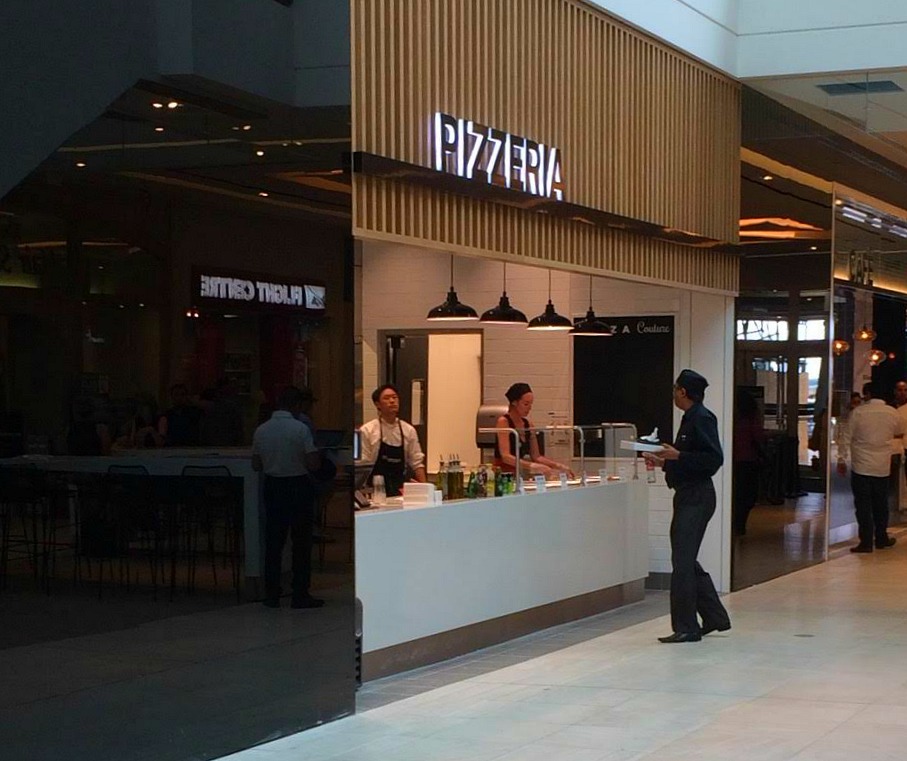 Pizza counter faces into the mall, drawing hungry shoppers towards the store. 