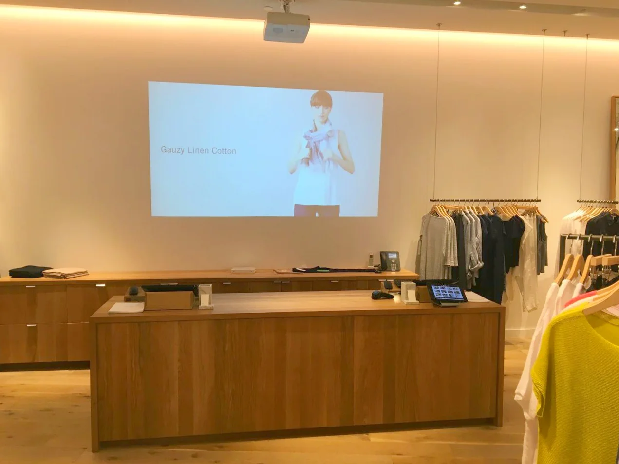 Wood cash desk with projection visual.&nbsp;Photo: Pace Construction