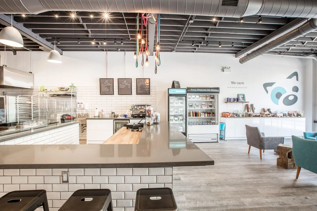 Kitchen area to the left, retail and seating area to the right. 