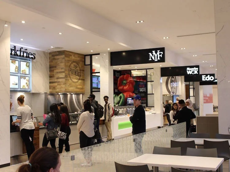 After: A modern food court with unified tenant branding. Photo: 20 Vic Management Inc.