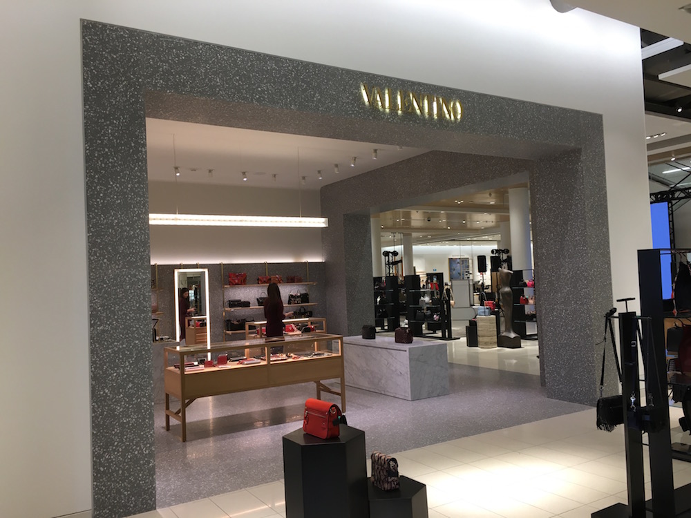(Valentino accessories boutique features a prominent corner location) 