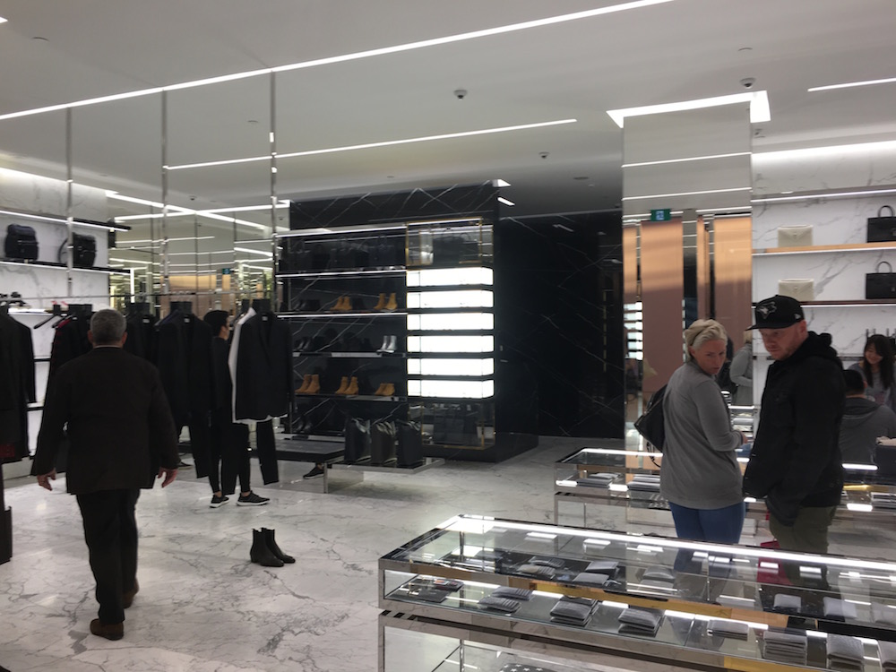 (Menswear to the left, with shoes on the back wall in this photo) 