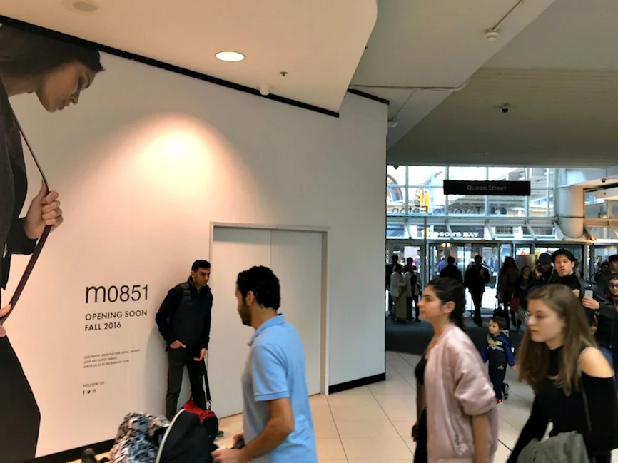 (Photo taken from within CF Toronto Eaton Centre, showing m0851 beside the busy Queen Street doors)&nbsp;