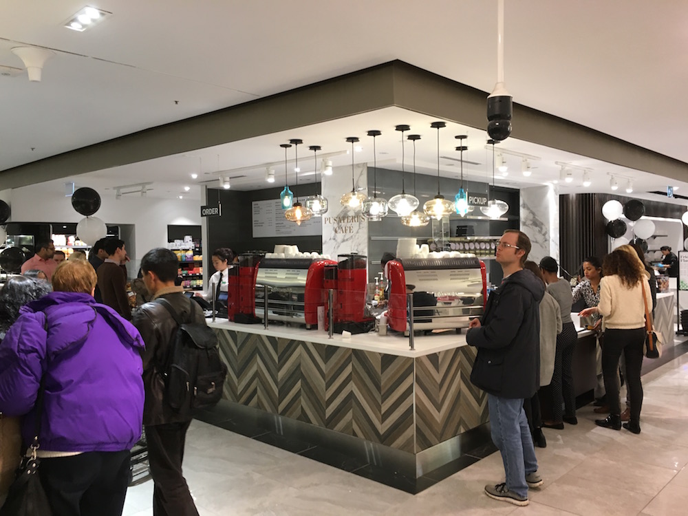 (Pusateri's Café, facing into the busy PATH) 