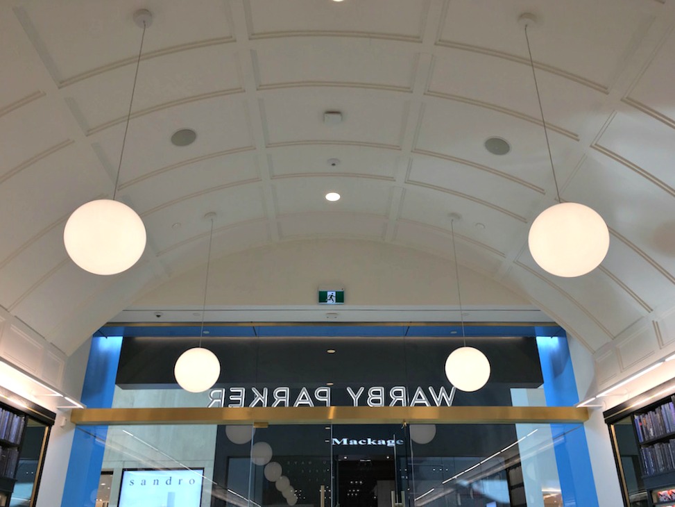 (Looking towards the front doors, examining the dramatic curved ceiling) 