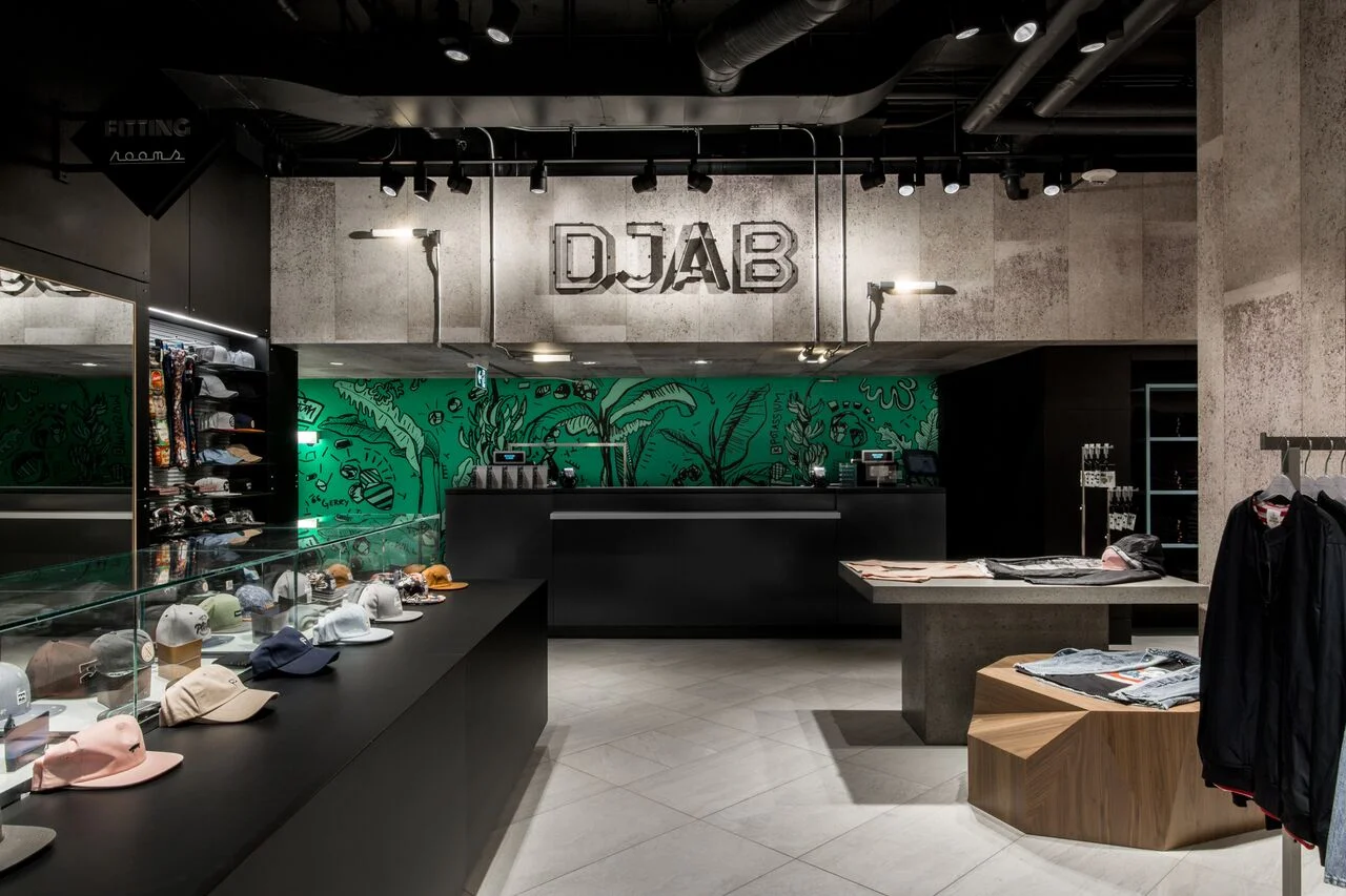 (Djab , the young men’s collections department, features a "raw feel with concrete walls, industrial lighting and cityscape graphics.