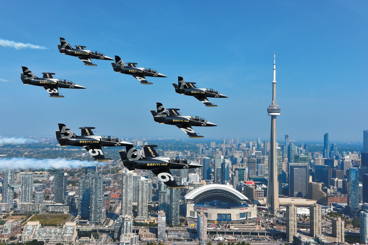 (Breitling jet team flying over toronto. photo Courtesy of Breitling SA, www.breitling.com )