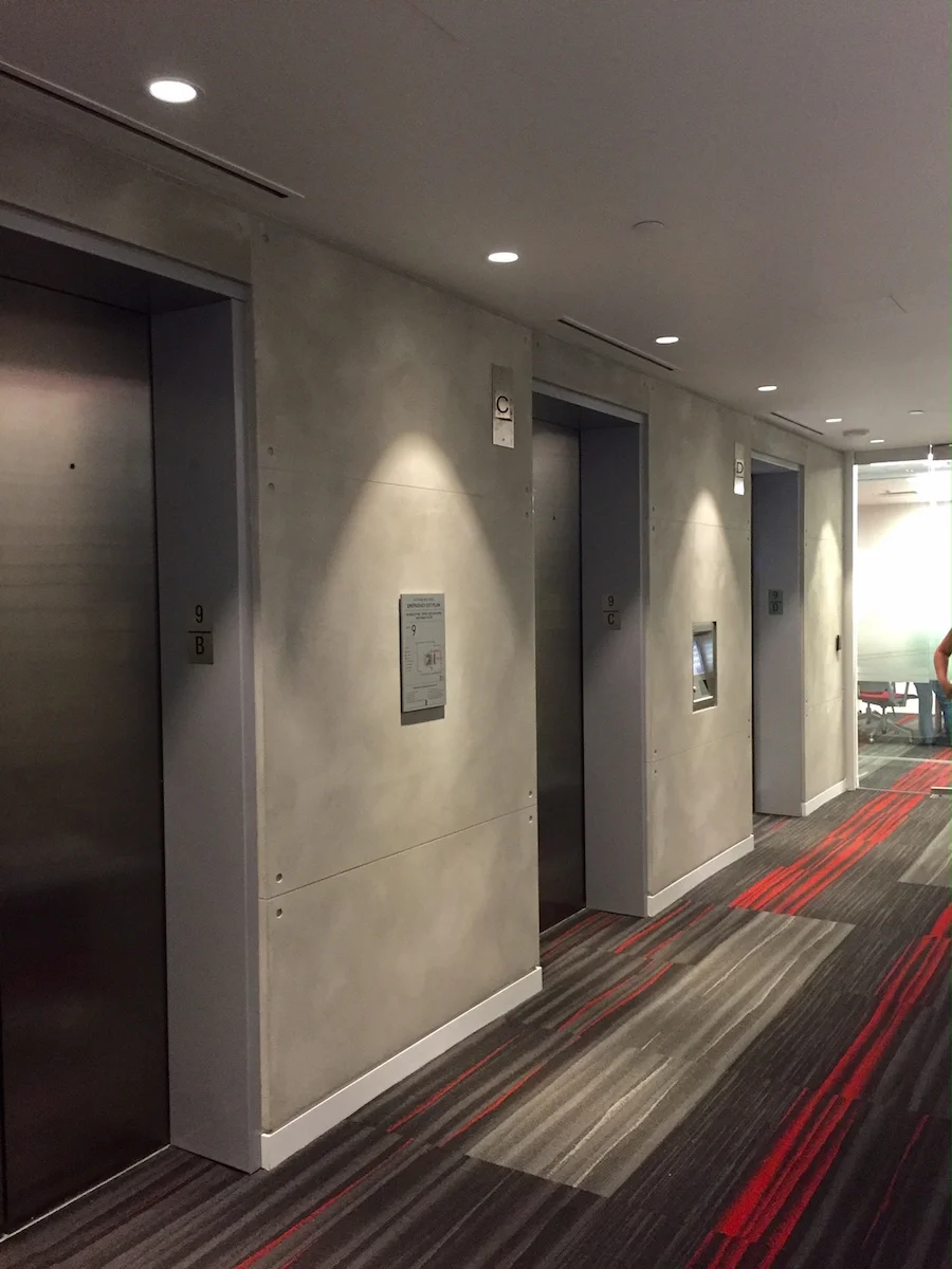 (elevator bank walls finished in plaster. Photo: Darrell Morrison)&nbsp;