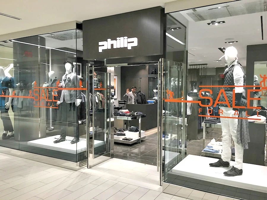 (philip Zappacosta of retailer 'philip' waves to retail insider from his store. the zappacosta family is opening canada's 1st belstaff store, as well as multi-brand menswear concept 'nanni' in the mall, this fall) 