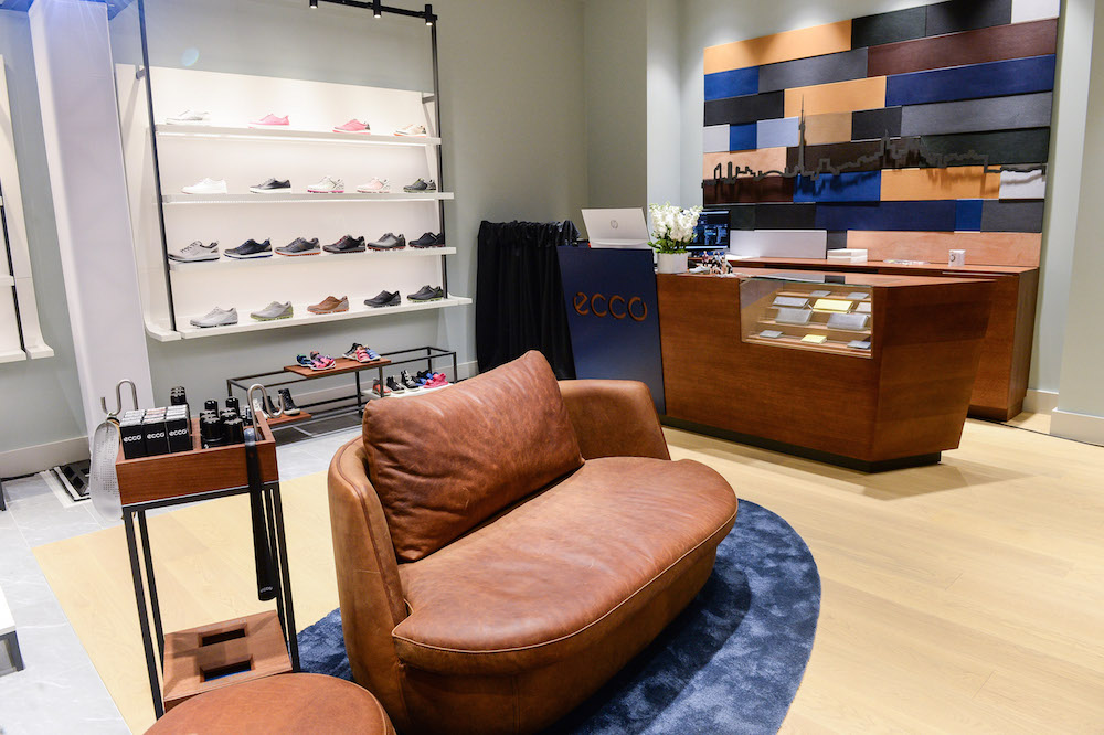 (The toronto skyline on a leather installation behind the store's cash desk. seating is elevated and comfortable) 
