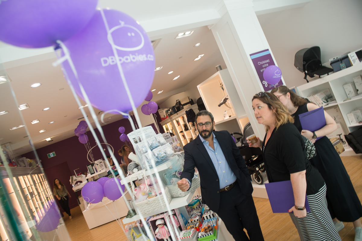 (Danny Haddad showing customers the new store) 