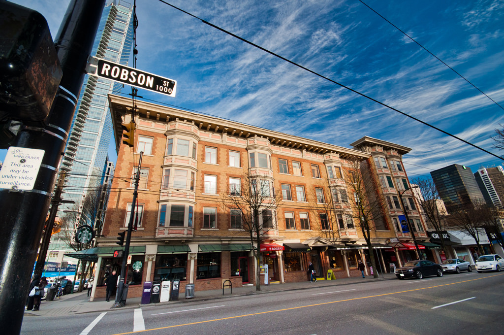 (Manhattan block at the northeast corner of robson street and thurlow street. Short buildings to the right to be demolished for a large, new retailer. Photo: Tourism Vancouver) 