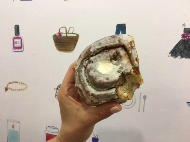 (Trying one of amy rosen's delicious cinnamon buns. Wallpaper is in the new space)&nbsp;