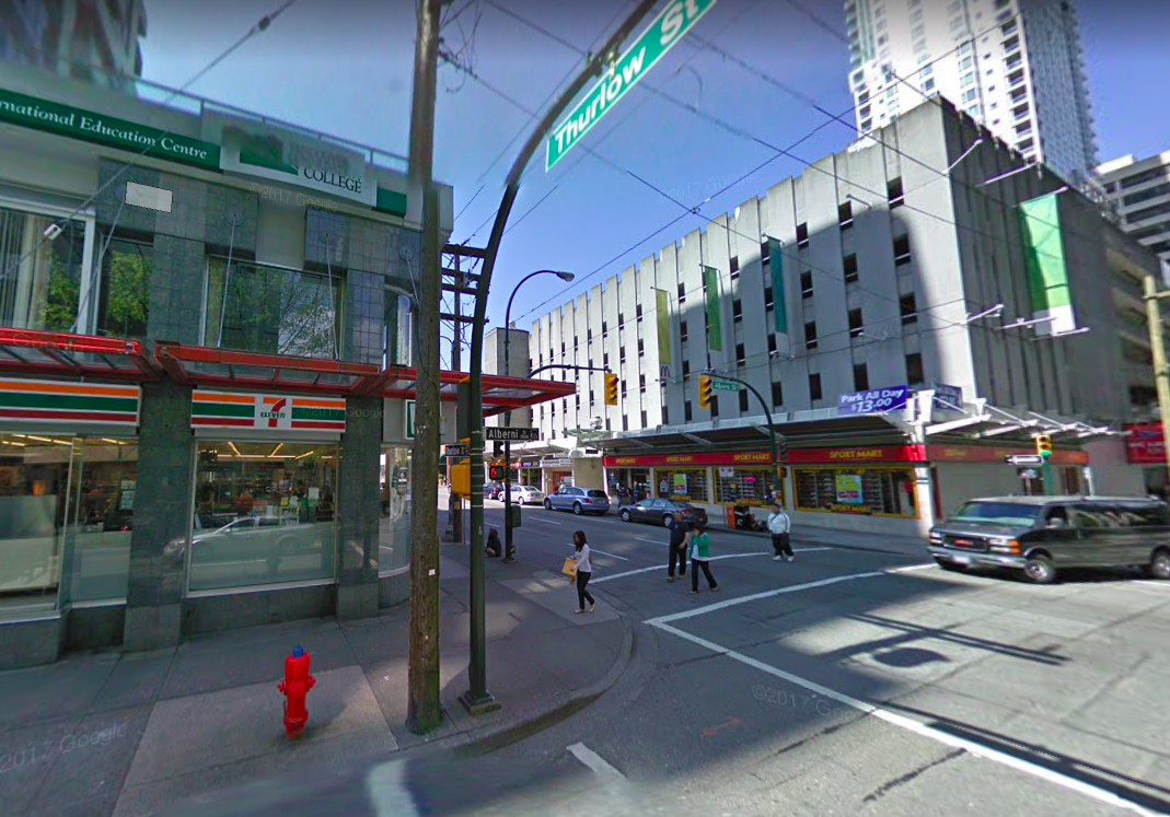 (Google Street view shot from April of 2009 -- Prada replaced 7-Eleven to the left and to the right, the parking garage was demolished for the 745 Thurlow Street office tower which houses Brunello Cucinelli and Versace at its base)