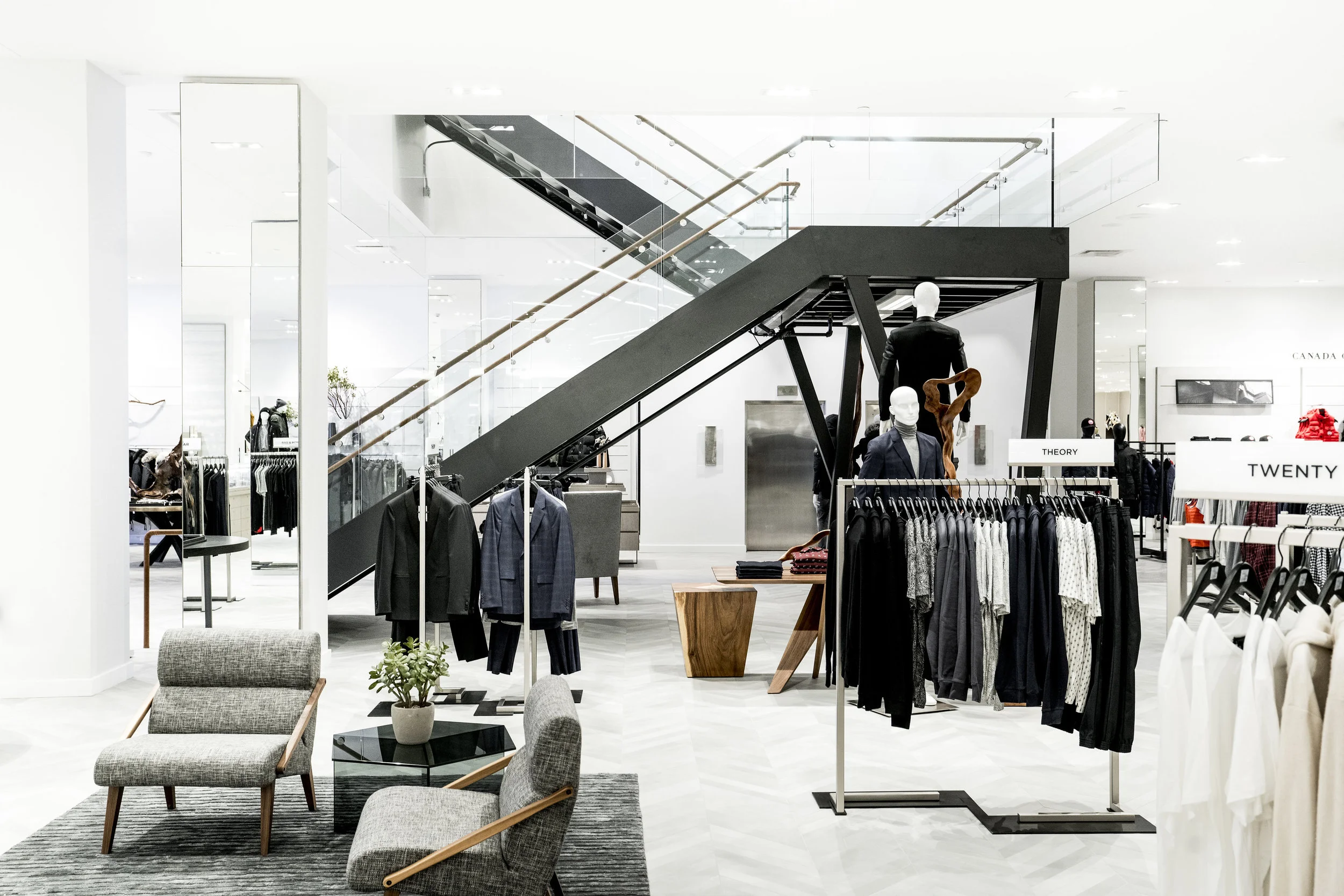 (The men's store on 1 and a stairway upstairs. Photo: Saks Fifth Avenue) 