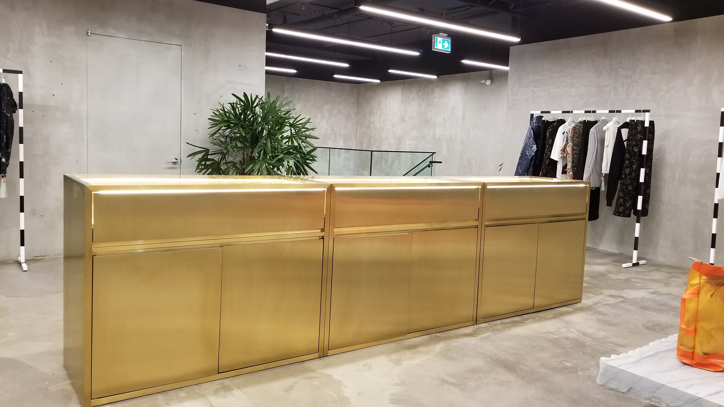 [Impressive gold cash desk on the store's second floor. PHoto: Helen Siwak]