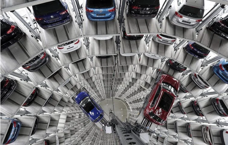 Volkswagen cars are lifted inside a delivery tower of the company in Wolfsburg, Germany in March 2017. The CEO of Volkswagen said the United States remains a core market for the company despite its diesel emissions scandal.&nbsp;(AP Photo/Michael Sohn)