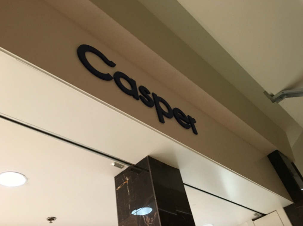 Branding on the storefront -- the store's facade was obscured during our tour on Monday, May 14, though we were able to capture this image as well as black marble pillars that will be part of the facade. 