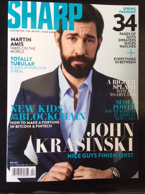 John Krasinski wears a Strellson ink-blue ‘Allen-Mercer’ suit on the front cover of Sharp Magazine's April 2018 edition. 